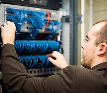 Technician at patch panel